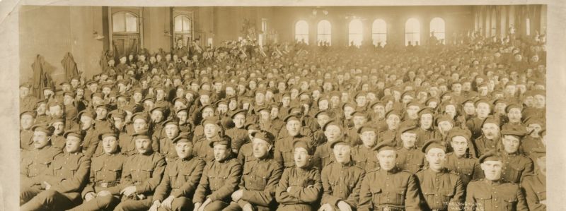 The 85th Battalion singing their song ‘85th Feather’ in the Halifax Armouries with the band in the background.