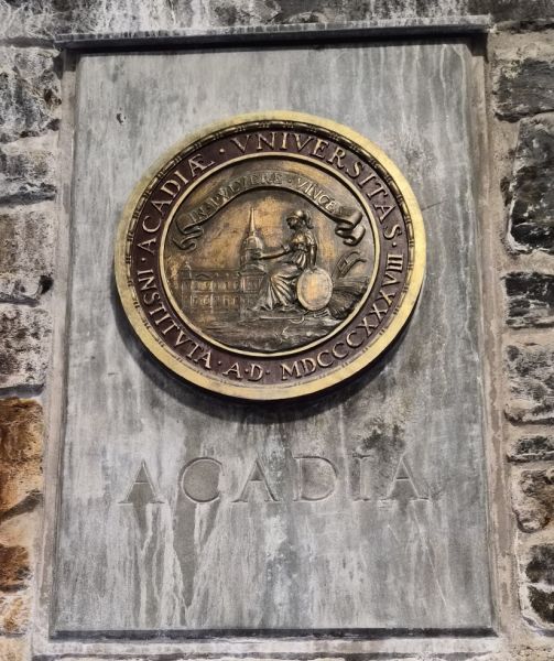 Acadia University seal at the Dingle Park in Halifax, NS. It is located inside the tower on the bottom floor, next to the tower's dedication plaque.