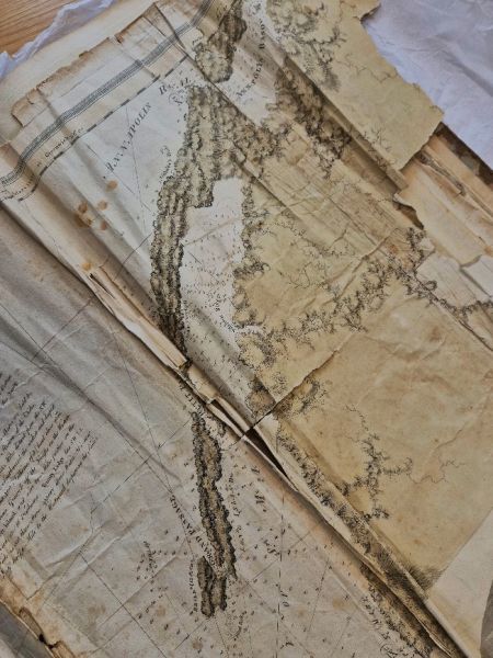 A section of the St. Mary’s Bay map in The Atlantic Neptune. The paper is creased and worn, with some tattered eges.